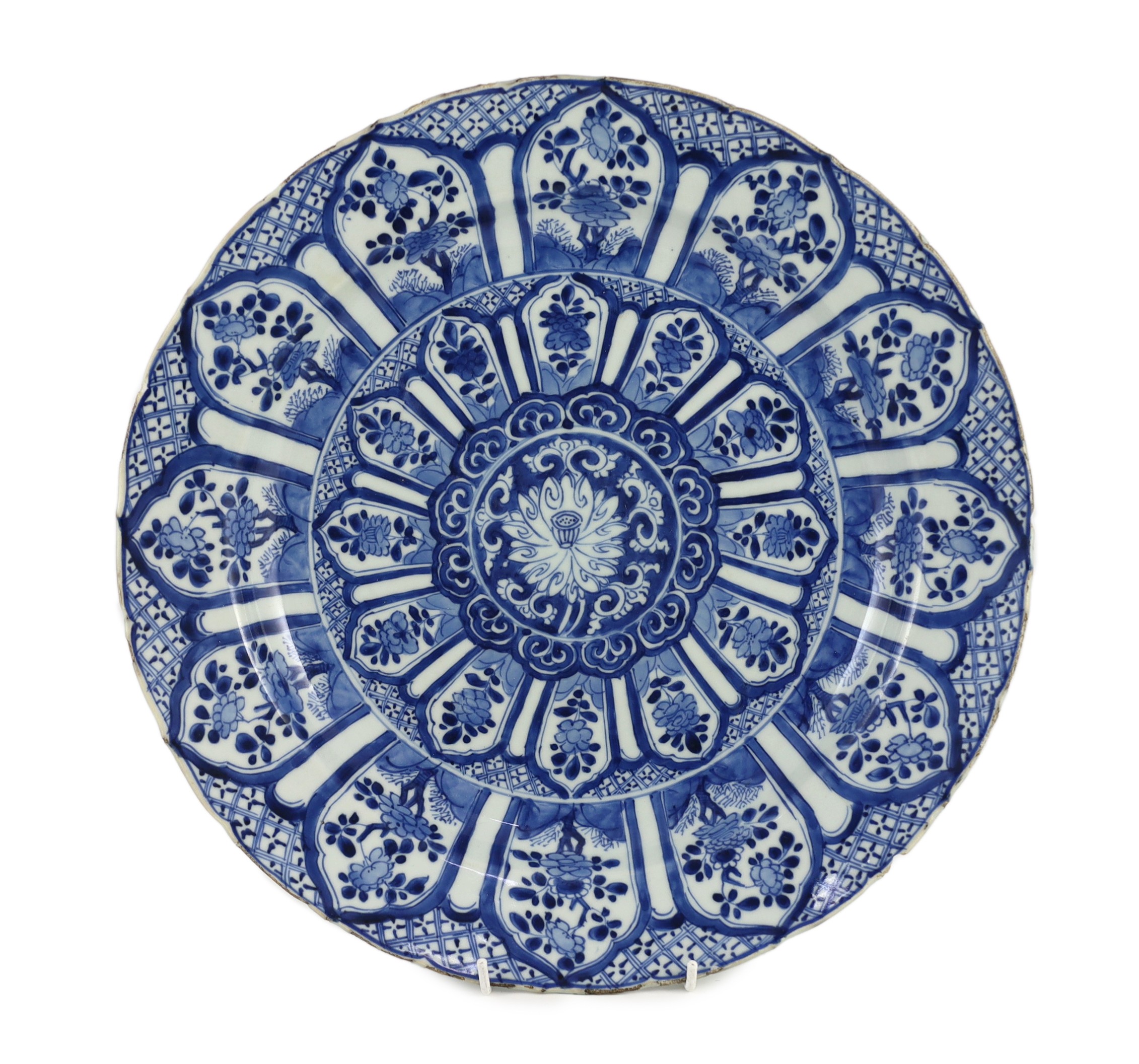 A Chinese blue and white panelled dish, Kangxi period, 36.5cm diameter, rim chip with hairline crack